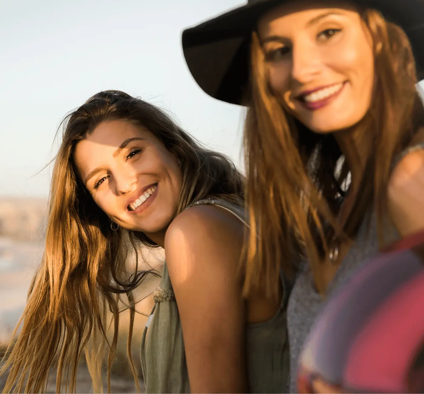 Friends enjoying a beachside sunset together, happiness and connection