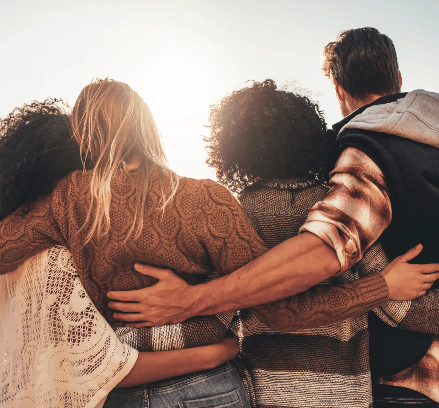 Carnivore diet community embracing at sunset, Kiltz Mighty Tribe